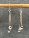 Swinging Balls In Circles Earrings