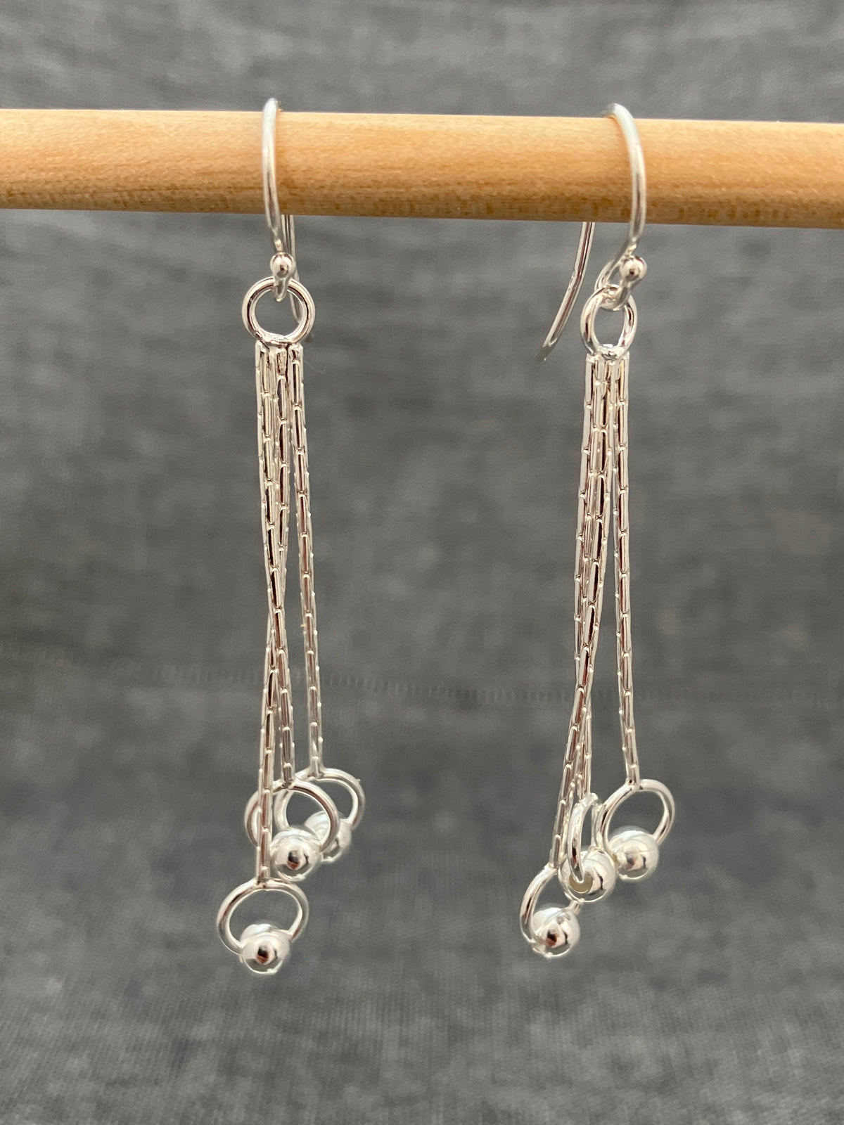 Swinging Balls In Circles Earrings