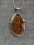 Amber Swirl Frame Oval Pendant